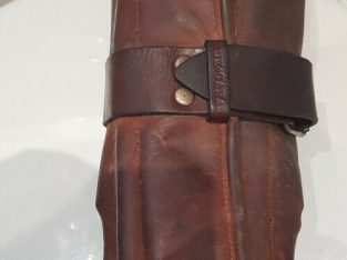 LOST brown leather tool roll containing tools, fastens with single large buckle