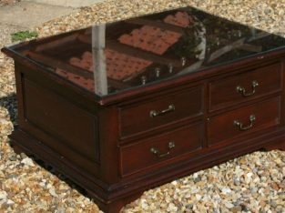 mahogany coloured 8 drawer coffee table glass topped