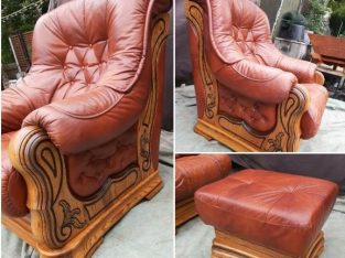 2 soft leather and carved wood armchairs with matching footstool